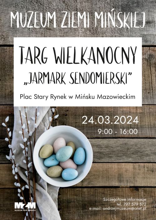Po środku zdjęcie bazi leżących na jasnym płótnie, obok stoi jasna miska z kolorowymi jajkami. Wszystko leży na ciemnym,...