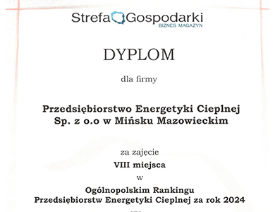 Szary tekst na białym tle. Na dole zdjęcie medalu z wygrawerowaną mapą Polski.